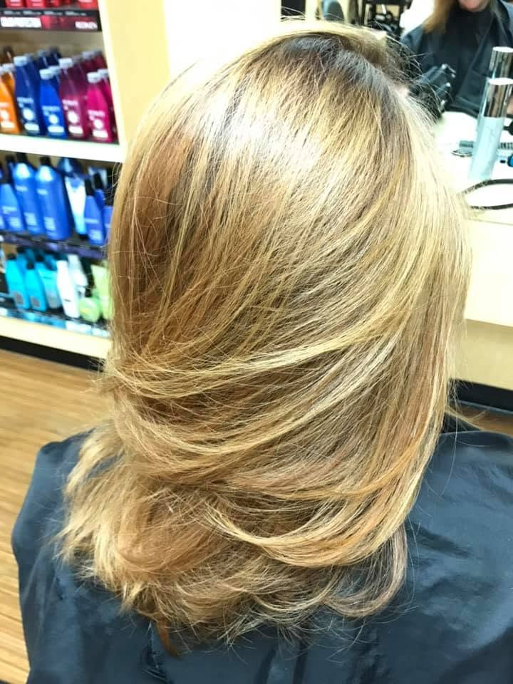 Layered blonde haircut by Lisa