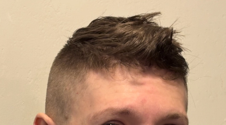 Men's fade with a textured top by Lisa